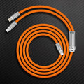 Coiled orange multi-head charging cable with metal connectors.