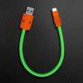 Green and orange USB-A to Type-C short charging cable.